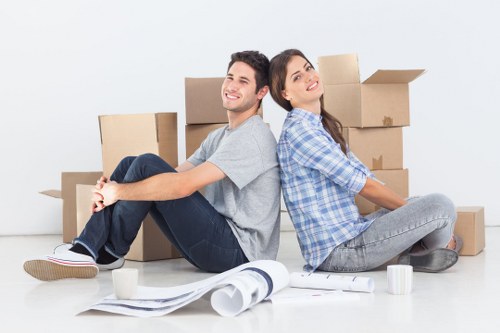 Professional movers loading furniture into a van