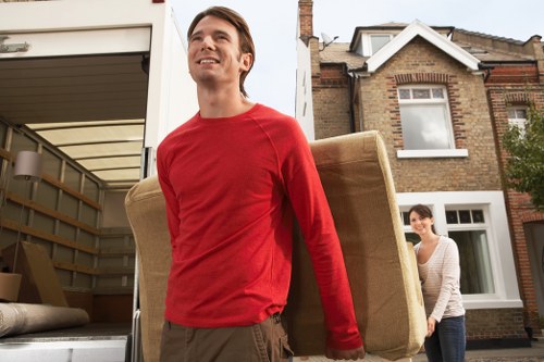 Moving team loading furniture with safety focus in Charlton