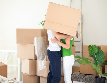 Packed boxes and essentials prepared for flat removals in Charlton