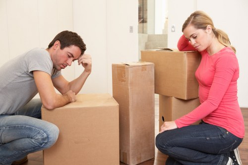 Professional movers loading furniture for a Charlton same day relocation