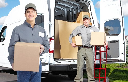 Local Charlton moving service loading belongings into a van