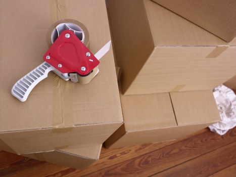 Charlton same day removals crew carrying boxes safely during a quick move