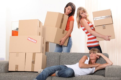 Trained staff handling boxes and equipment carefully