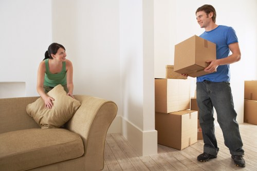 Unpacking boxes in a Charlton property after delivery