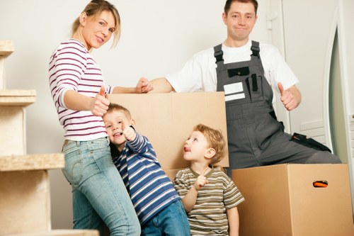 Staff member wearing PPE while loading furniture